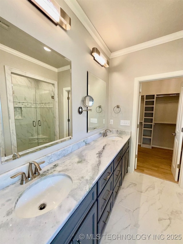 14503 E 80th St N, Owasso, OK 74055 - bathroom with crown molding, a marble finish shower, double vanity, a walk in closet, and marble finish flooring
