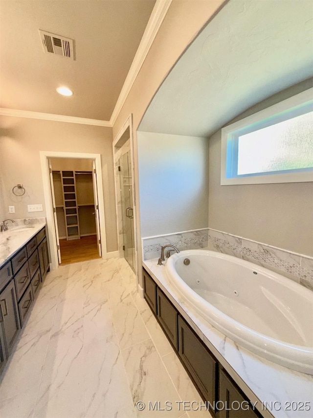 14503 E 80th St N, Owasso, OK 74055 - bathroom with a tub with jets, a shower stall, double vanity, crown molding, and a walk in closet