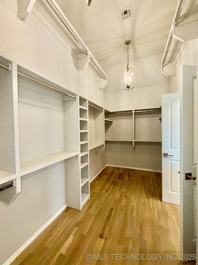 14503 E 80th St N, Owasso, OK 74055 - walk in closet with wood finished floors