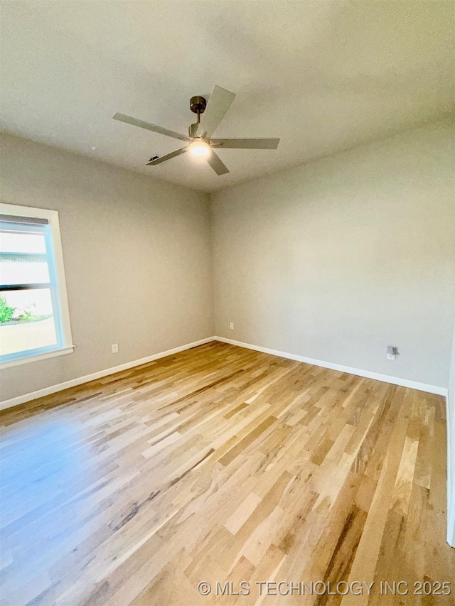 14503 E 80th St N, Owasso, OK 74055 - spare room featuring baseboards, wood finished floors, and a ceiling fan