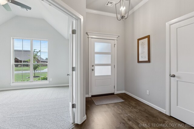 23012 E 104th St S, Broken Arrow, OK 74014 - entryway with dark wood-style floors, ornamental molding, baseboards, ceiling fan, and a chandelier