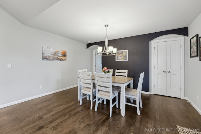 23012 E 104th St S, Broken Arrow, OK 74014 - dining area with a chandelier, wood finished floors, and arched walkways
