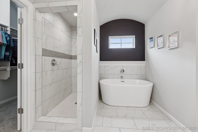 23012 E 104th St S, Broken Arrow, OK 74014 - full bath featuring a freestanding tub, tiled shower, marble finish flooring, a walk in closet, and baseboards