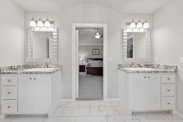 23012 E 104th St S, Broken Arrow, OK 74014 - full bathroom featuring marble finish flooring, two vanities, ensuite bathroom, and baseboards