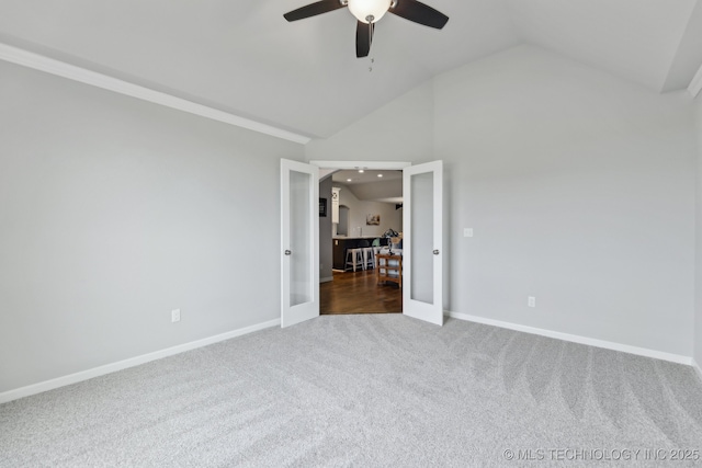 23012 E 104th St S, Broken Arrow, OK 74014 - carpeted spare room with a ceiling fan, lofted ceiling, baseboards, and french doors