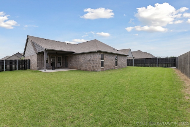 23012 E 104th St S, Broken Arrow, OK 74014 - back of property with a patio, brick siding, and a shingled roof