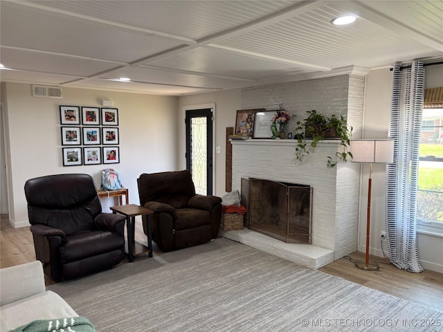 1113 S Meadow Dr, Ardmore, OK 73401 - living room featuring wood finished floors, baseboards, a fireplace, and recessed lighting