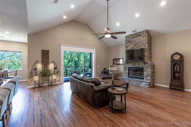 11802 Hickory Ln, Claremore, OK 74017 - living area featuring ceiling fan, high vaulted ceiling, a fireplace, wood finished floors, and recessed lighting