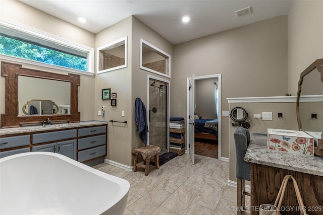11802 Hickory Ln, Claremore, OK 74017 - bathroom with a freestanding bath, connected bathroom, vanity, and a shower