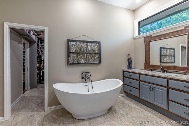 11802 Hickory Ln, Claremore, OK 74017 - full bath with a freestanding tub, vanity, and a spacious closet