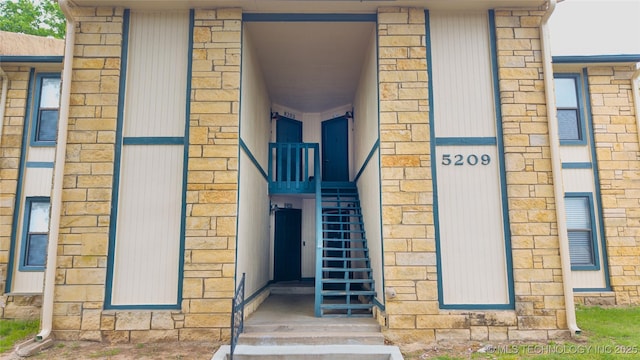 5209 SE Nowata Rd Unit 104B, Bartlesville, OK 74006 - doorway to property with stone siding