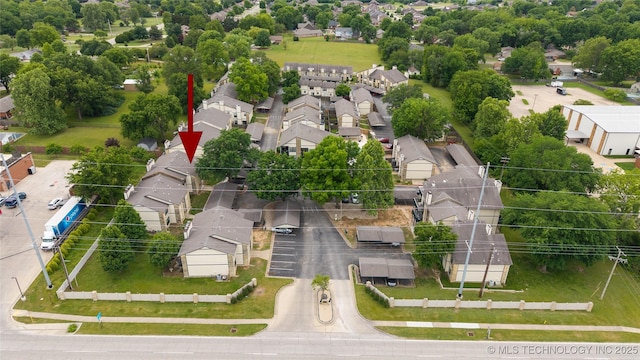 5209 SE Nowata Rd Unit 104B, Bartlesville, OK 74006 - aerial perspective of suburban area featuring a tree filled landscape