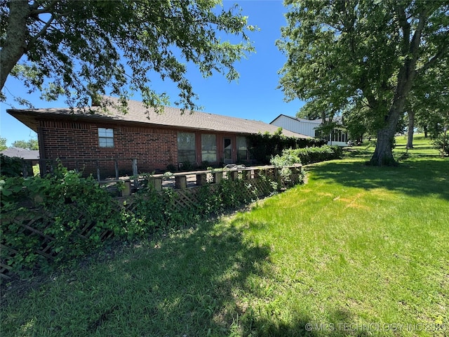 50 Fairway, Burneyville, OK 73430 - rear view of property with a yard and brick siding