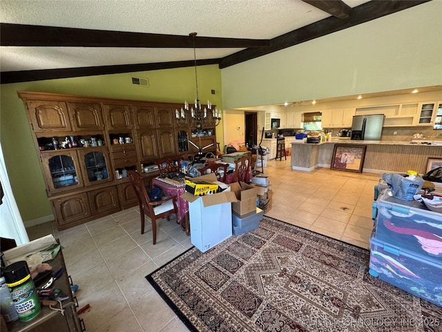 50 Fairway, Burneyville, OK 73430 - living room featuring beamed ceiling, light tile patterned floors, a chandelier, a textured ceiling, and high vaulted ceiling