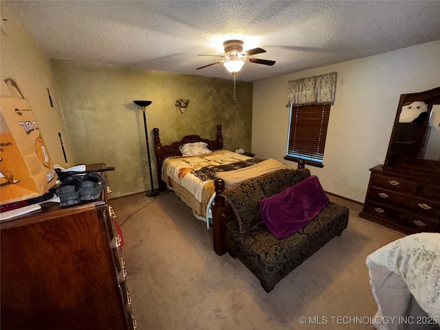 50 Fairway, Burneyville, OK 73430 - bedroom featuring carpet floors, a textured ceiling, baseboards, and a ceiling fan