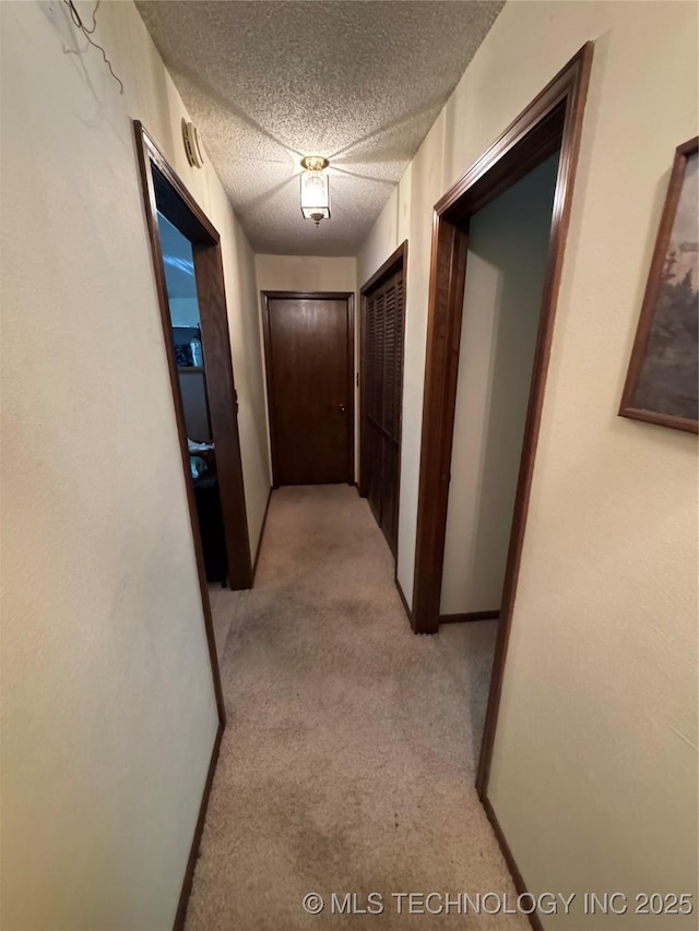 50 Fairway, Burneyville, OK 73430 - hallway with light colored carpet and a textured ceiling