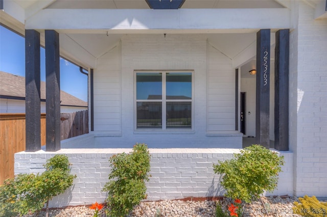 25363 E 87th St S, Broken Arrow, OK 74014 - view of side of home featuring brick siding and covered porch