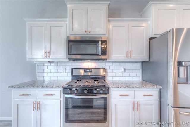 25363 E 87th St S, Broken Arrow, OK 74014 - kitchen featuring appliances with stainless steel finishes, white cabinetry, backsplash, and light stone countertops