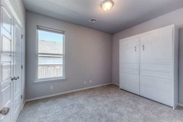 25363 E 87th St S, Broken Arrow, OK 74014 - unfurnished bedroom featuring light carpet and baseboards