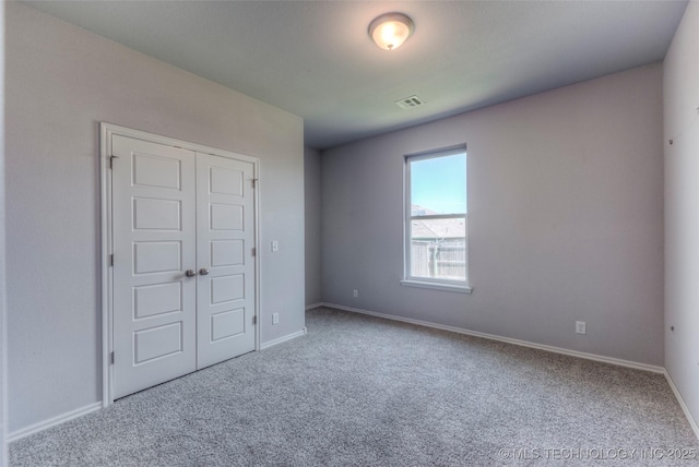 25363 E 87th St S, Broken Arrow, OK 74014 - unfurnished bedroom with carpet flooring, baseboards, and a closet