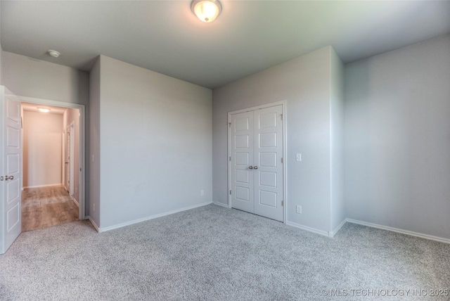 25363 E 87th St S, Broken Arrow, OK 74014 - unfurnished bedroom with carpet floors, baseboards, and a closet