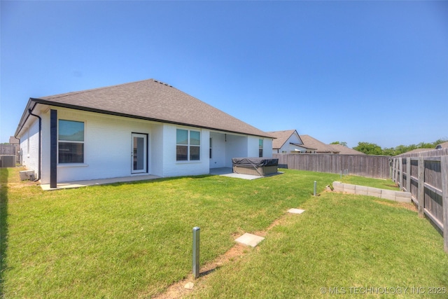 25363 E 87th St S, Broken Arrow, OK 74014 - back of house with a hot tub, a shingled roof, a patio, brick siding, and central AC