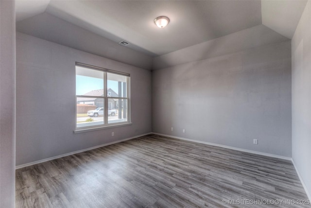 25363 E 87th St S, Broken Arrow, OK 74014 - empty room with lofted ceiling, wood finished floors, and baseboards