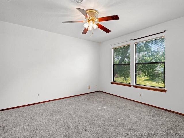 5217 Nowata Rd Unit C204, Bartlesville, OK 74006 - unfurnished room with carpet, baseboards, and a ceiling fan