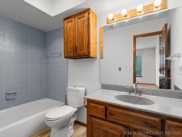 5217 Nowata Rd Unit C204, Bartlesville, OK 74006 - bathroom featuring vanity, toilet, and shower / bathtub combination