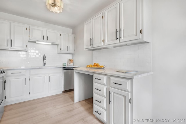 1602 N Hickory Ave, Broken Arrow, OK 74012 - kitchen with a sink, dishwasher, white cabinets, and light countertops