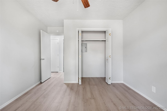 1602 N Hickory Ave, Broken Arrow, OK 74012 - unfurnished bedroom featuring light wood-style floors, a closet, a textured ceiling, baseboards, and ceiling fan