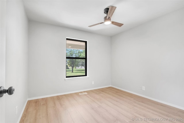1602 N Hickory Ave, Broken Arrow, OK 74012 - spare room with wood finished floors, ceiling fan, and baseboards