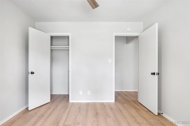 1602 N Hickory Ave, Broken Arrow, OK 74012 - unfurnished bedroom with wood finished floors, baseboards, a closet, and ceiling fan