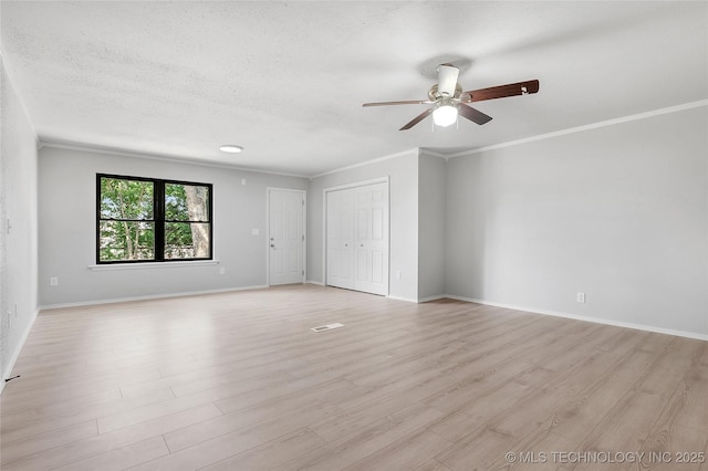1602 N Hickory Ave, Broken Arrow, OK 74012 - spare room with ceiling fan, ornamental molding, light wood-style floors, baseboards, and a textured ceiling