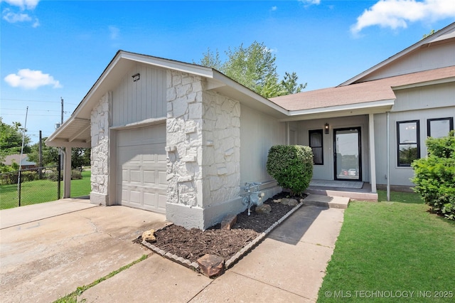 1602 N Hickory Ave, Broken Arrow, OK 74012 - view of front facade featuring stone siding, an attached garage, and driveway