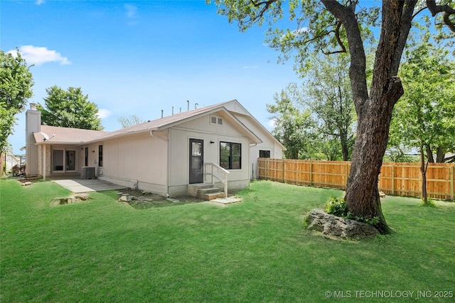 1602 N Hickory Ave, Broken Arrow, OK 74012 - back of house with entry steps, cooling unit, a chimney, and a patio