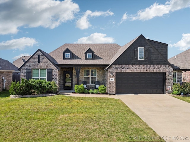 18409 E 50th Pl S, Tulsa, OK 74134 - view of front of home with brick siding, concrete driveway, and a front lawn
