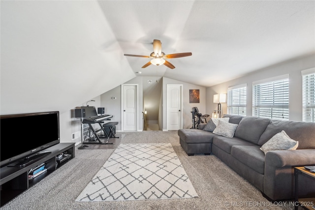 18409 E 50th Pl S, Tulsa, OK 74134 - living room with carpet flooring, a ceiling fan, vaulted ceiling, and a desk