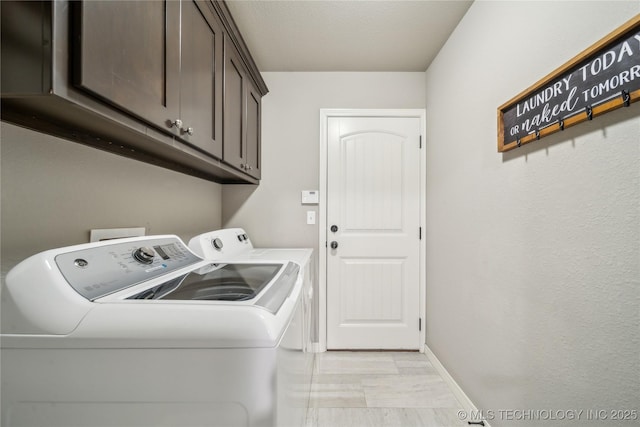 18409 E 50th Pl S, Tulsa, OK 74134 - washroom featuring washing machine and dryer, cabinet space, light marble finish flooring, and baseboards