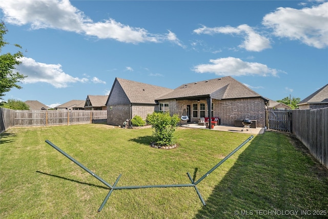 18409 E 50th Pl S, Tulsa, OK 74134 - back of property featuring a patio, brick siding, and roof with shingles