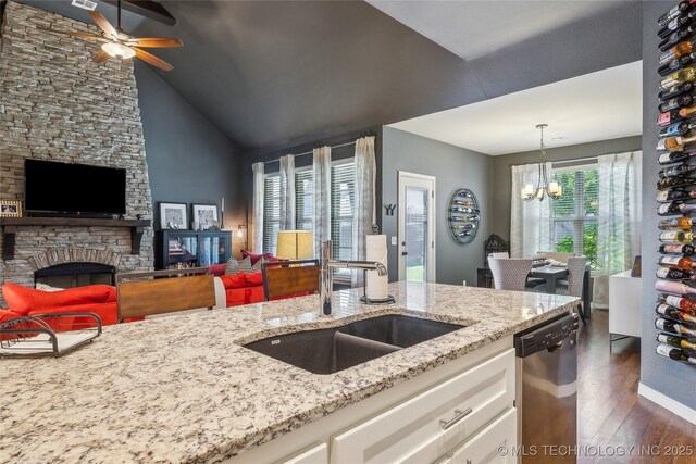 18409 E 50th Pl S, Tulsa, OK 74134 - kitchen with dishwasher, open floor plan, a sink, a chandelier, and lofted ceiling