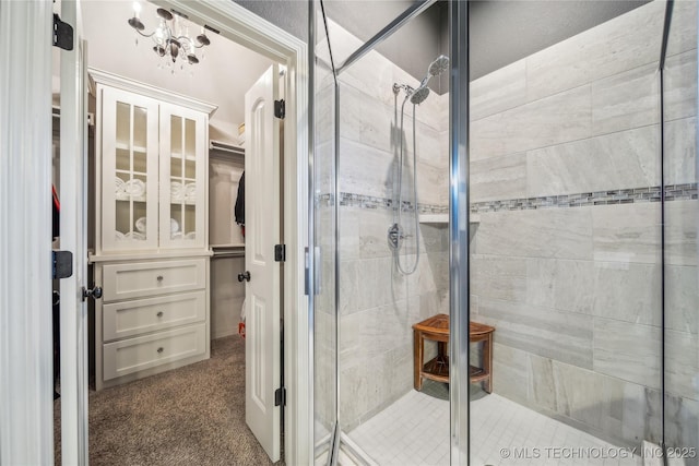 18409 E 50th Pl S, Tulsa, OK 74134 - bathroom featuring a stall shower and a spacious closet