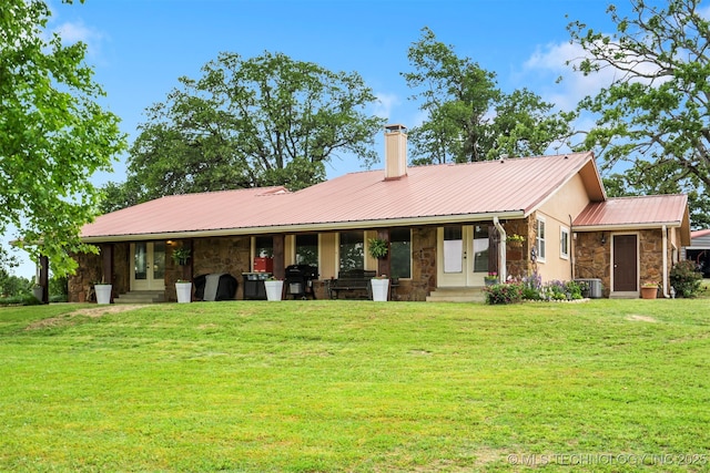 20700 E 420th Rd, Claremore, OK 74017 - view of front of property with stone siding, french doors, a chimney, and a front yard