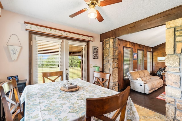 20700 E 420th Rd, Claremore, OK 74017 - dining room featuring wooden walls, beamed ceiling, french doors, a ceiling fan, and wood finished floors
