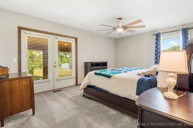 20700 E 420th Rd, Claremore, OK 74017 - carpeted bedroom with access to exterior, french doors, and a ceiling fan