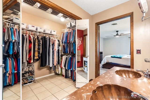 20700 E 420th Rd, Claremore, OK 74017 - walk in closet with tile patterned flooring and ceiling fan