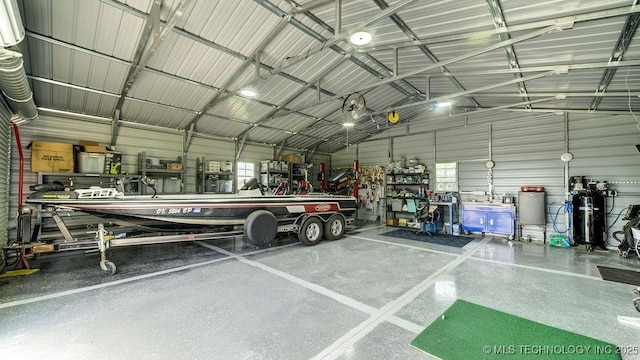 20700 E 420th Rd, Claremore, OK 74017 - garage featuring metal wall and a workshop area