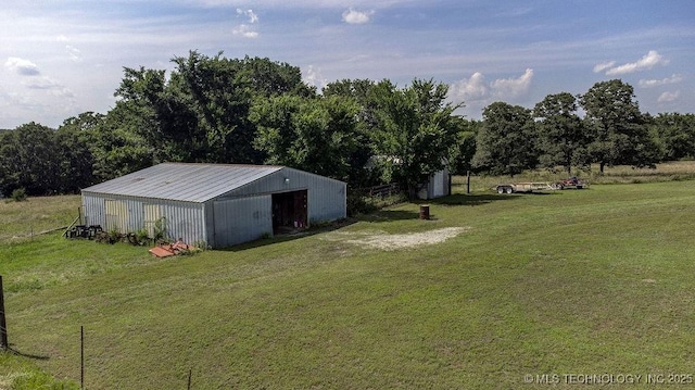 20700 E 420th Rd, Claremore, OK 74017 - view of green lawn with a pole building, an outdoor structure, and a detached garage