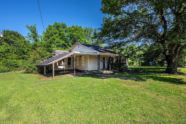506 S 8th, Davis, OK 73030 - view of side of home with a yard