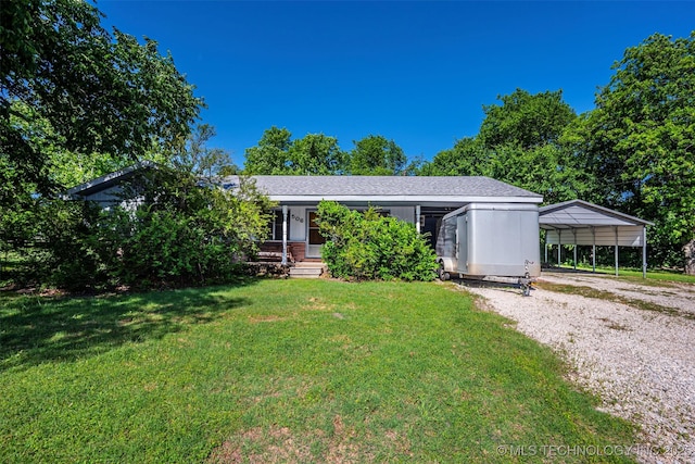 506 S 8th, Davis, OK 73030 - view of front of home with a front lawn, gravel driveway, and a detached carport